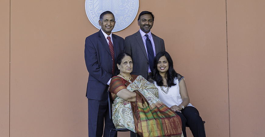 The Lakireddy family poses in front of UC Merced's Dr. Lakireddy Auditorium, one of the largest lecture halls on campus. Top: Dr. Hanimireddy Lakireddy and his son Dr. Vikram Lakireddy; Bottom: Hanimireddy's wife Vijaya and his daughter-in-law, Priya.