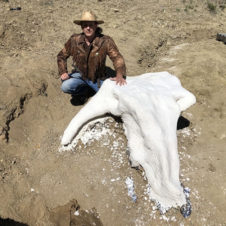Michael Kjelland poses with Alice after she has been treated with foil and plaster for protection.