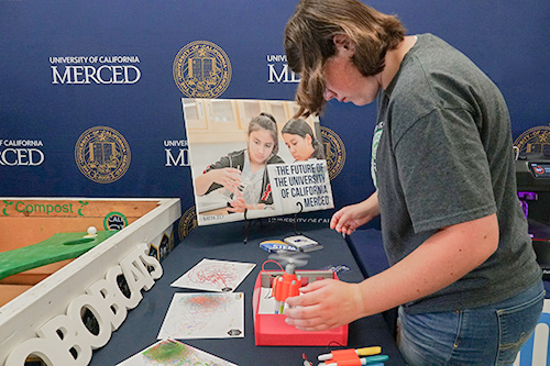 A student plays with the scribble bots.