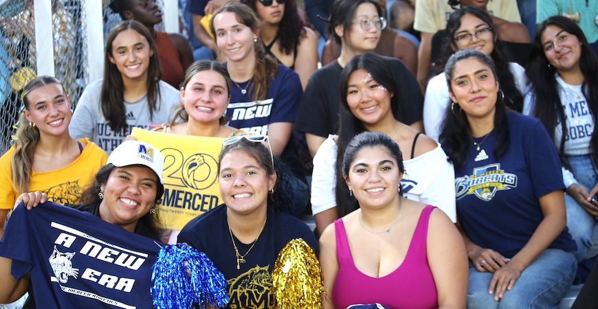 Photo depicts a crowd of people watching the UC Merced women's soccer game.