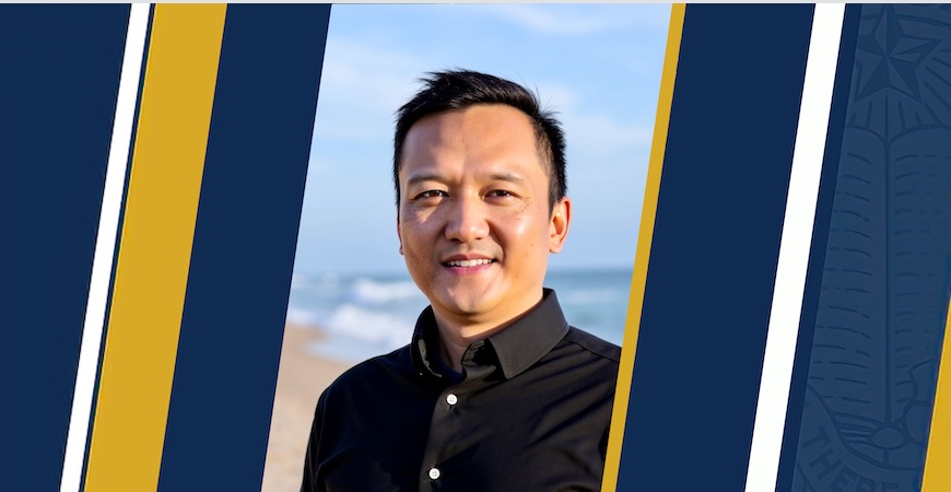Photo depicts Professor Xiaoyi Lu on a blue and gold graphc background. 