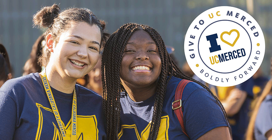 Two UC Merced students smiling at the camera